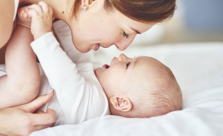 Woman playing with her baby